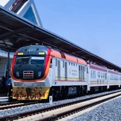 Kenya Standard Gauge Railway train at a station platform with passengers boarding